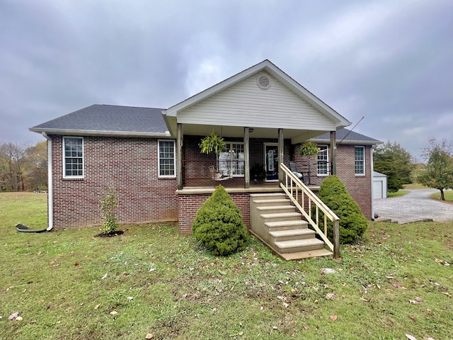 view of front of house featuring a porch and a front lawn