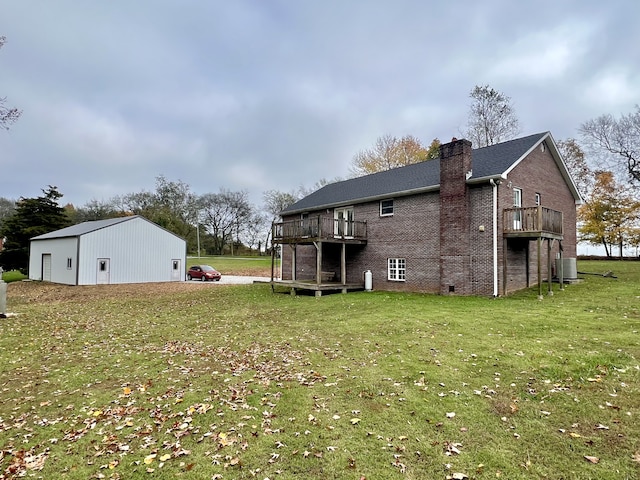 exterior space featuring a wooden deck and a lawn