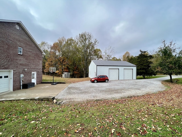 garage featuring a lawn