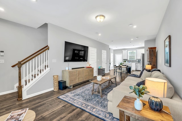 living room featuring dark wood-type flooring