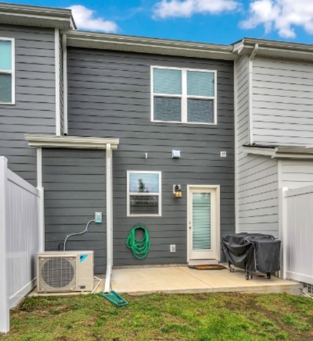 back of house featuring ac unit and a patio area