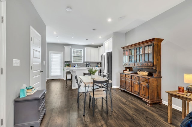 dining area with dark wood-type flooring