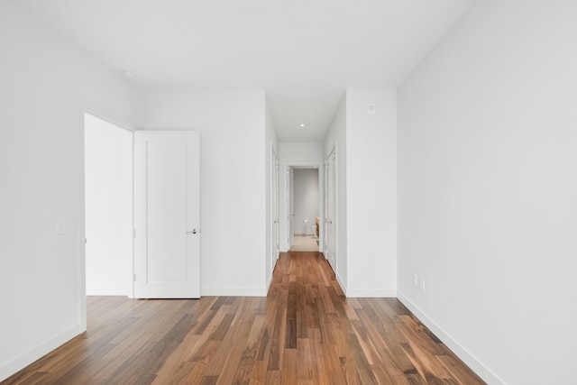 hallway featuring dark wood-type flooring