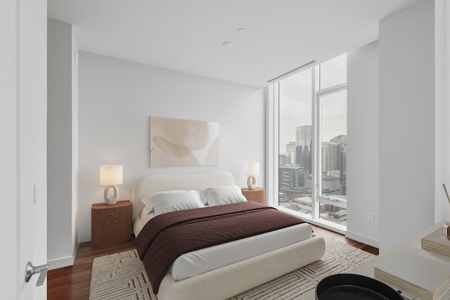 bedroom featuring access to exterior and wood-type flooring