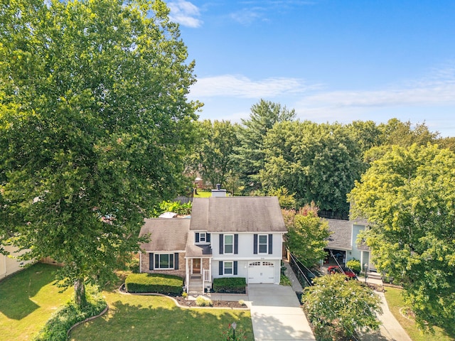 view of front of home with a garage and a front yard