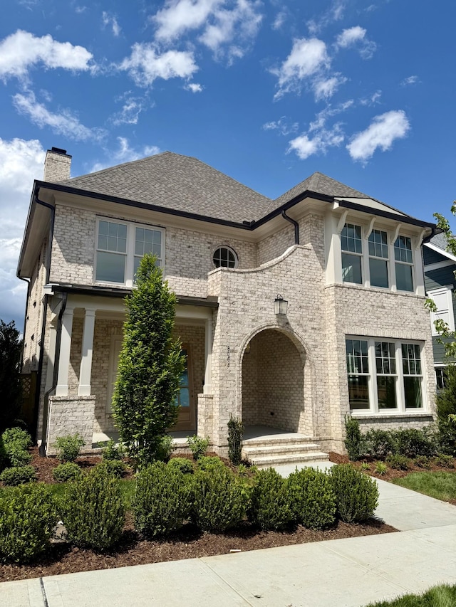 8006 Southvale Blvd, Franklin, TN 37064 - view of front of property featuring brick siding, a chimney, and roof with shingles