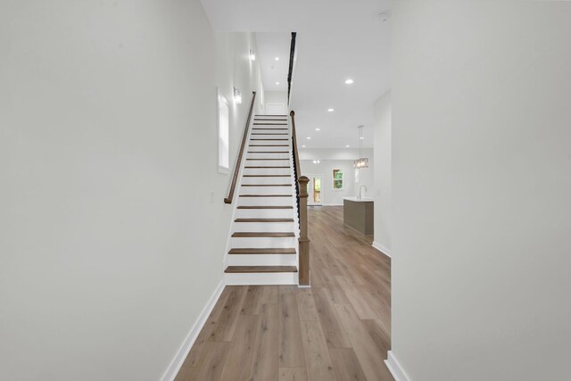 stairway with wood-type flooring