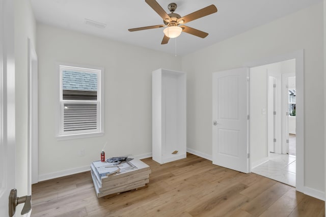 bedroom featuring light hardwood / wood-style floors and ceiling fan