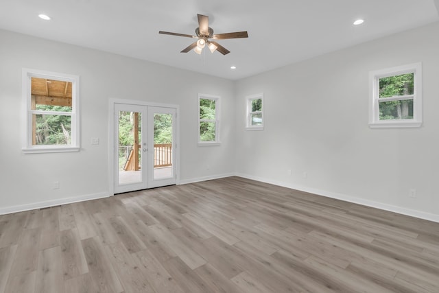 unfurnished room featuring french doors, light hardwood / wood-style floors, and ceiling fan