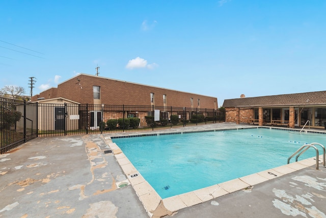 view of swimming pool with a patio area