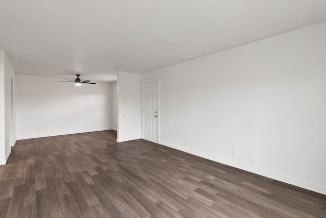 spare room featuring ceiling fan and dark hardwood / wood-style floors