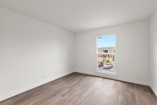 unfurnished room with light hardwood / wood-style flooring