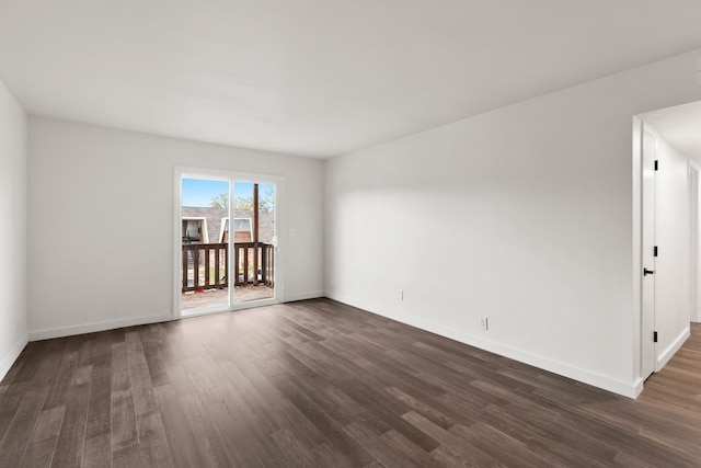 spare room featuring dark hardwood / wood-style floors