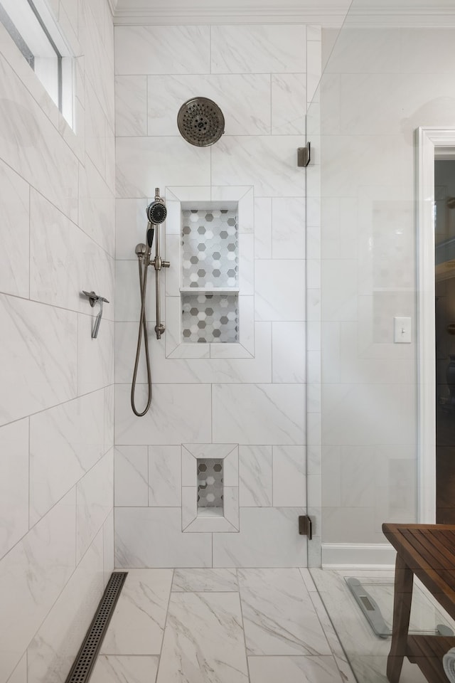 bathroom with a tile shower