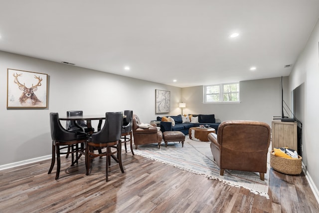 dining space with hardwood / wood-style floors