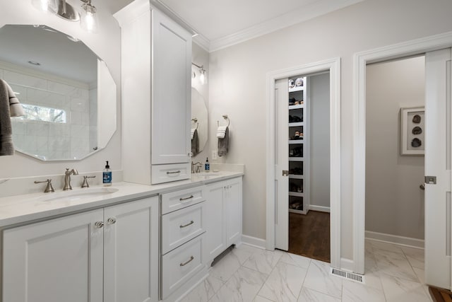 bathroom with vanity and crown molding