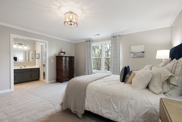 carpeted bedroom with ornamental molding, a notable chandelier, sink, and connected bathroom