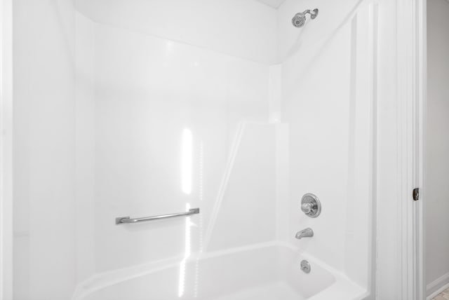 bathroom featuring  shower combination