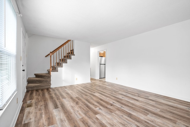 unfurnished living room with light wood-type flooring