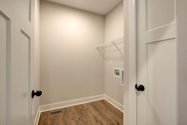 washroom featuring hookup for a washing machine and hardwood / wood-style floors