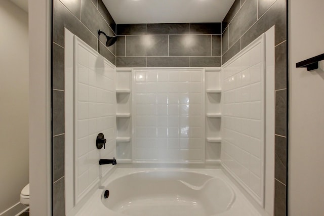 bathroom with toilet and tub / shower combination