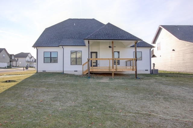 rear view of house featuring cooling unit, a lawn, ceiling fan, and a deck