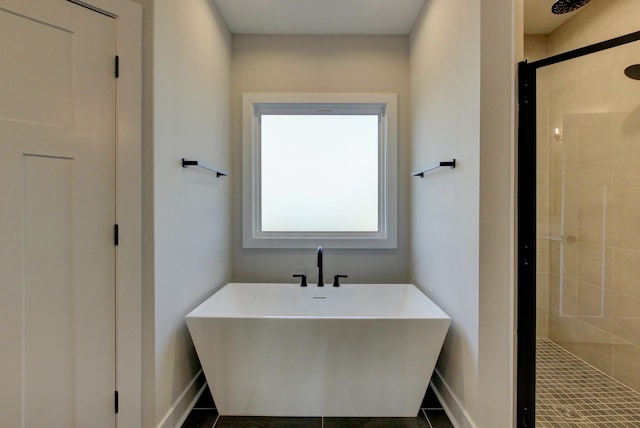 bathroom featuring tile patterned floors, independent shower and bath, and sink