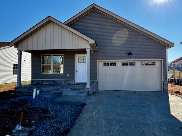 view of front of home with a porch and a garage