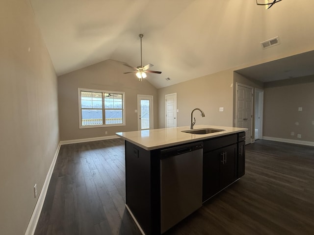 kitchen with lofted ceiling, sink, dark hardwood / wood-style flooring, stainless steel dishwasher, and a center island with sink