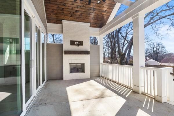 view of patio featuring a fireplace