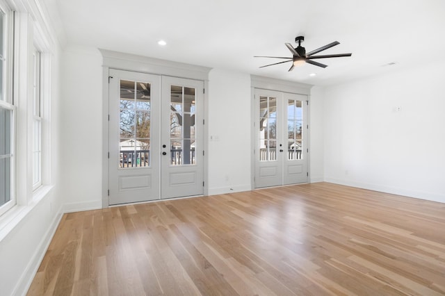 interior space featuring french doors, light wood-type flooring, recessed lighting, and baseboards