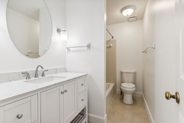 full bathroom featuring tile patterned floors, vanity, tiled shower / bath combo, and toilet