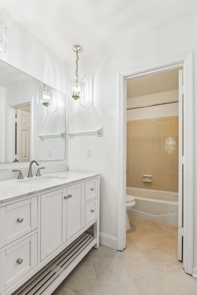 bathroom featuring tile patterned floors, vanity, and toilet