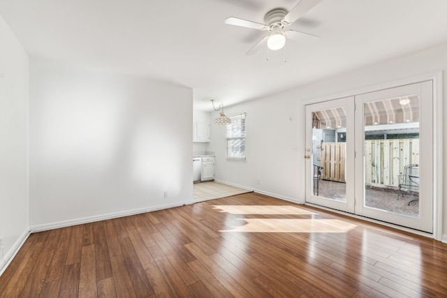 empty room featuring light wood-type flooring and ceiling fan