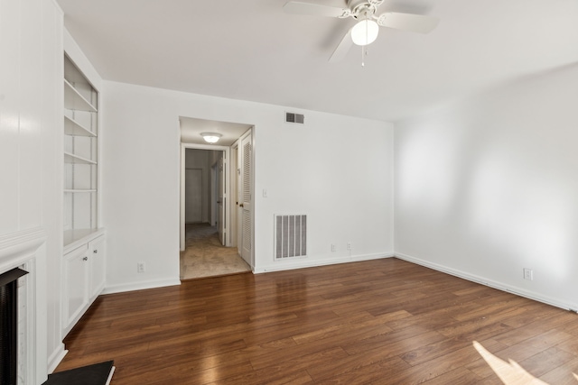 unfurnished room featuring dark hardwood / wood-style flooring and ceiling fan