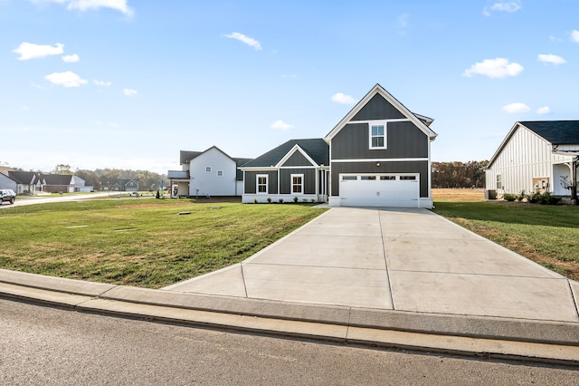 view of front of home featuring a garage and a front lawn