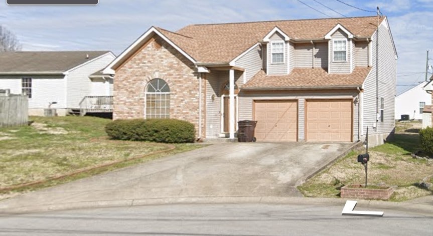 view of front of property with a garage