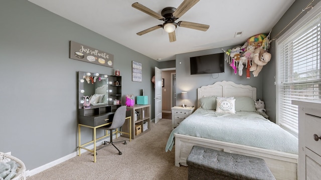 bedroom featuring ceiling fan and light colored carpet