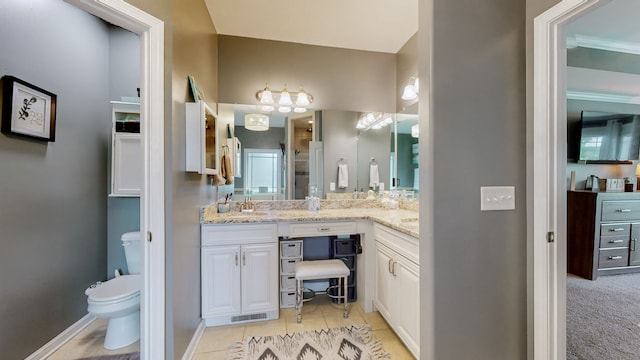 bathroom with tile patterned floors, vanity, and toilet