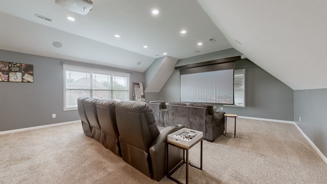 home theater with lofted ceiling and light colored carpet