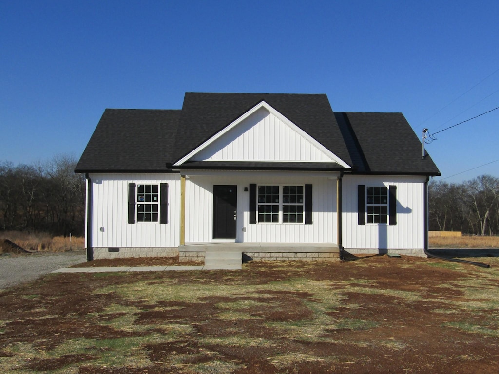 modern farmhouse style home with covered porch