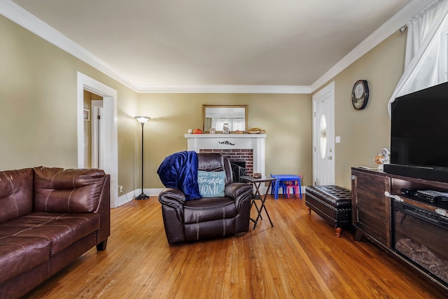 living room with a fireplace, light wood-type flooring, and ornamental molding