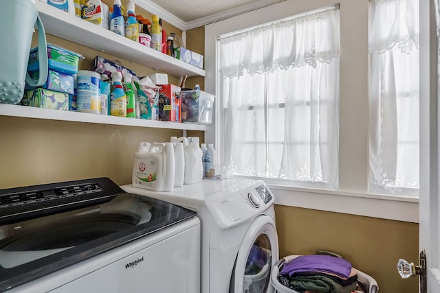 washroom with a wealth of natural light, washer and clothes dryer, and ornamental molding