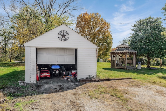 garage featuring a lawn