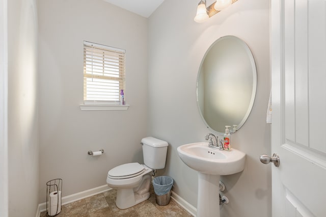 bathroom with toilet and sink