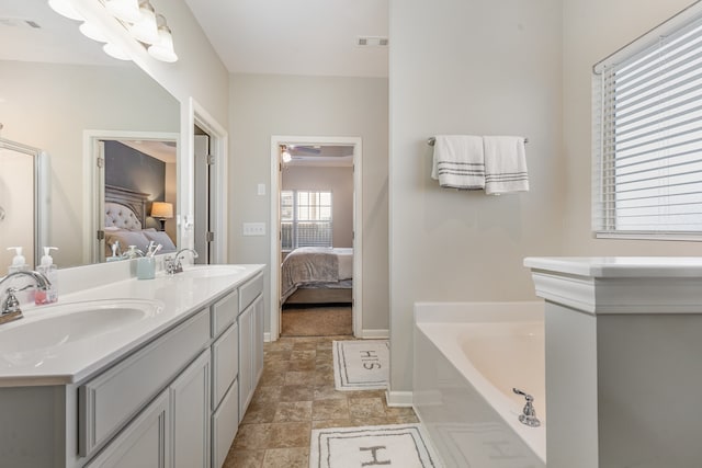 bathroom featuring a bathing tub and vanity