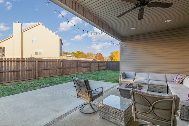 view of patio with an outdoor living space and ceiling fan