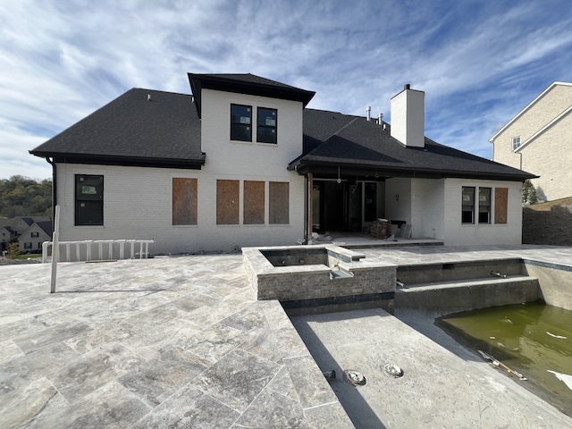 rear view of house featuring a patio area