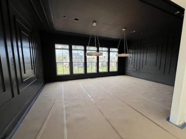 unfurnished dining area with ornamental molding