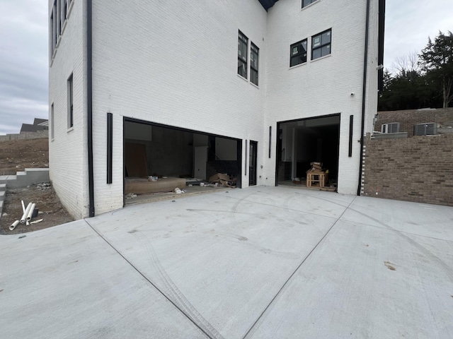 view of side of home featuring a garage